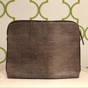 India Hicks Insider brown lizard embos’d leather.